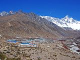 Kongma La 25 Dingboche With Nuptse and Lhotse South Face Behind The trail is easy from the valley floor at Bibre to Dingboche, taking another 35 minutes. The village of Dingboche (4350m) gets larger and larger every year. The south faces of Nuptse and Lhotse dominate the view from Dingboche.